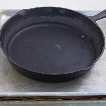 cast iron skillet pressing 