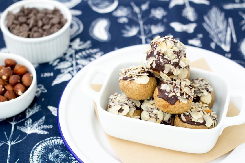 energy balls dipped in chocolate in a bowl